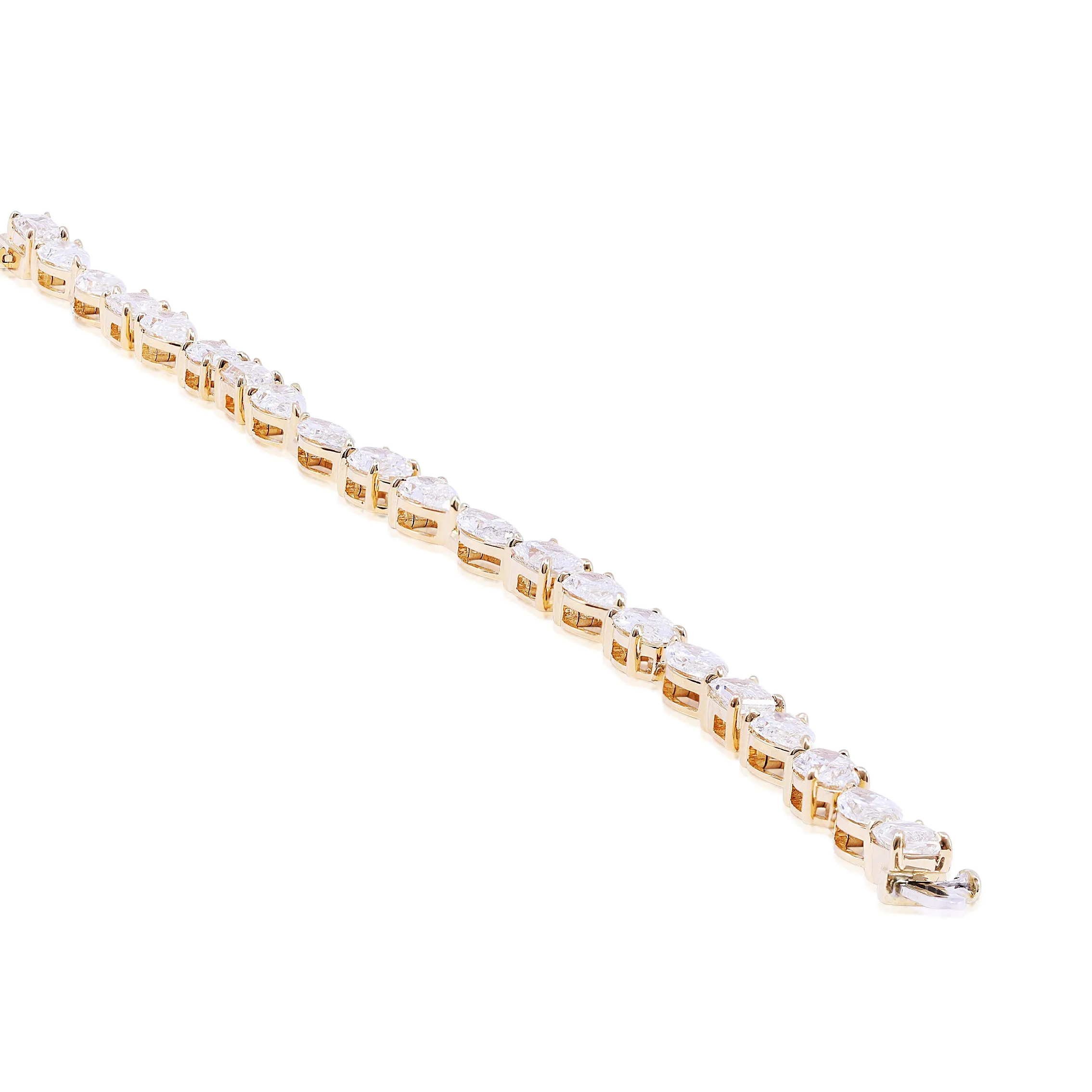 18K YELLOW GOLD MIXED CUT OVAL, PEAR, MARQUISE AND EMERALD-CUT DIAMOND BRACELET - 10.72CTW